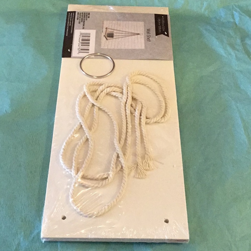 Hanging wall shelf. New in package